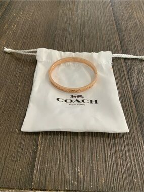 COACH Rose Gold Tone Kissing C Hinged Bangle Bracelet